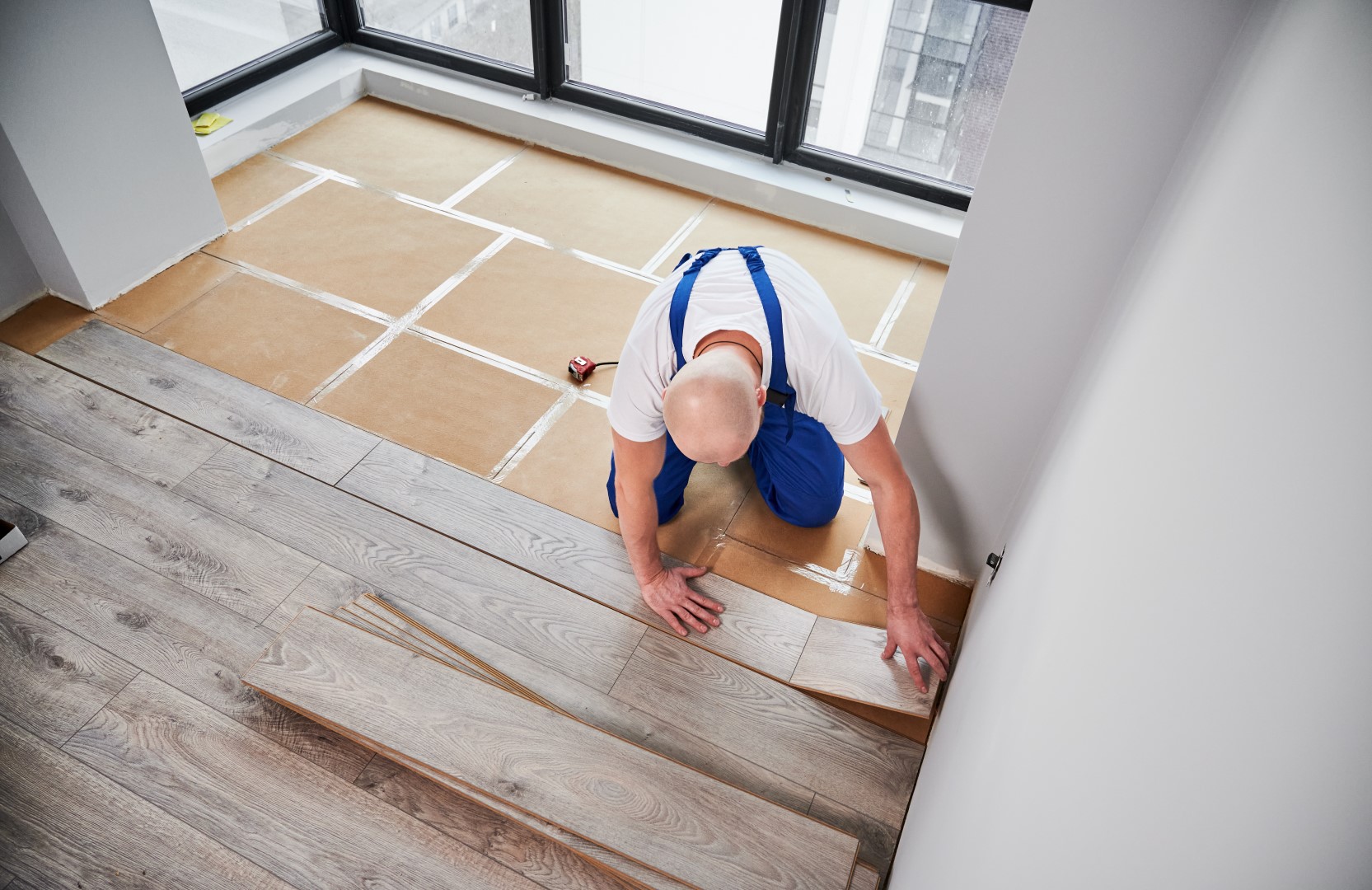 man performing a floor installation