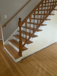 A spacious room with warm wood floors