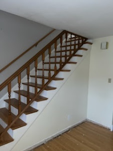 A spacious room with warm wood floors